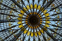 chrysanthemum-style domed glass roof window with yellow and white petal rings