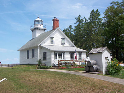 Mission Point Lighthouse sits at the end of the Old Mission Peninsula, which divides the bay into its East and West Arms.