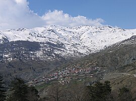 View on Aetomilitsa village. Peaks of Gramos mountain visible in the background