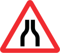 Road narrows on both sides