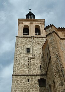 A stone tower. Crosses can be seen in the windows.
