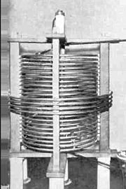 Antenna transformer inductively couples antenna of AM radio station to transmitter