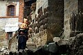 Water buffalo dung drying on a wall in a Hani ethnic minority village in Yuanyang county