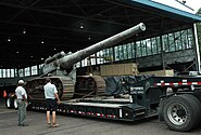 Transportation personnel at Naval Support Facility Dahlgren prepare to off-load a World War I-era 7-inch gun on a tracked mount, the first gun originally test-fired to mark the establishment of Dahlgren as a naval proving ground on Oct. 16, 1918. The 7-inch, 45 caliber gun will be restored by the Naval Surface Warfare Center Dahlgren Division.