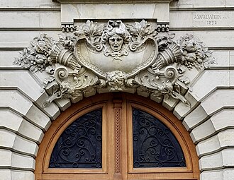 Two Beaux-Arts mascarons of Avenue Henri-Martin no. 87, Paris, designed by Albert Walwein, 1892