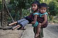 Image 19In Bangladesh there are many tribal people live in Sylhet, Dinajpur, Cox's Bazar, Mymensingh, Rajshahi etc. But majority of tribal people live in the Chittagong Hill Tracts. This picture features a tribal kid with her little sister tied in her back at Farukpara, Bandarban, Bangladesh. Photo Credit: Mohammad Rakibul Hasan