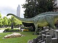 Diplodocus longus dinosaur model and columnar basalt in front of the Senckenberg Museum, Frankfurt.