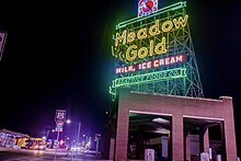 Restored Beatrice Foods Meadow Gold ice cream neon sign on Route 66 in Tulsa, Oklahoma.