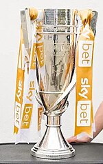 The trophy awarded to the play-off winners, pictured in Port Vale colours in 2022