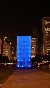 night time view of large illuminated physical structure.