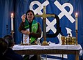 Chaplain Lt. Barbara Wood presides over communion service aboard the USS Abraham Lincoln.