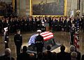 Coughlin (at podium) delivering invocation at memorial service for former President Gerald Ford, 2006.