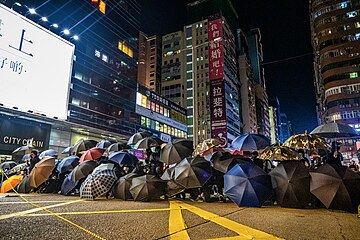 Protesters using umbrellas