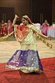 Woman with a ghoonghat performing a Ghumar dance.