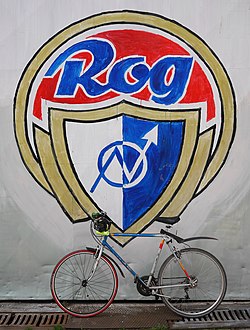 Bike in front of logo