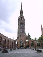 The surviving tower and steeple, which functions as a working bell tower.