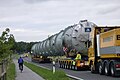 MAN ballast tractor pushing hydraulic modular trailer with bolster configuration.