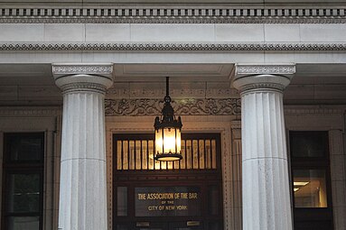 Greek Revival columns at the entrance of the House of the New York City Bar Association, New York City, inspired by the one from the Temple of Hera I at Paestum, but decorated with meanders on the abacuses and bands of compressed leafs that are a little more complex and bases you would never see on Ancient Greek Doric columns (not visible in this photo), by Cyrus Eidlitz, 1895