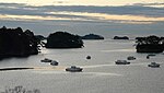 Sea with small islets completely covered with trees.