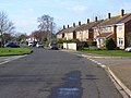 Part of Fane Drive, the main road within the village