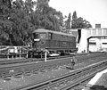 Electric locomotive at Acton Town. This shows an example of the class of 20 electric locomotives introduced by the Metropolitan Railway from 1922 onwards. The example shown here is No. 12, Sarah Siddons.