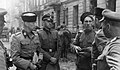 Enemies: SS-Gruppenführer Heinz Reinefarth "Butcher of Wola" (on the left), General of police and Waffen-SS and the Regiment III of Cossacks of Jakub Bondarenko during Warsaw Uprising around Wolska street. Third Regiment of Cossacks contained mix of Cossacks from many regions, and Jakub Bondarenko was commanding 5th Regiment of Kuban Cossack Infantry.