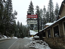 The town as seen heading eastbound on US-50. The sign references a well-known joke about small towns.