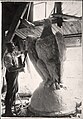 Man working on eagle for the dome.