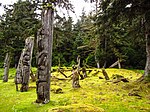 Wooden totem poles in a forest