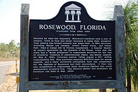 A color photograph of the back of the bronze plaque in Rosewood