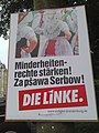 Dvikalbis rinkimų plakatas Kotbuso gatvėje