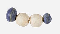 Beads of lapis lazuli and travertine, circa 3650–3100 BCE. Naqada II–Naqada III.