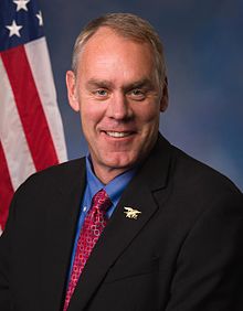 Upper-body portrait of a man in a suit.