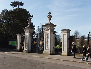 Elizabeth Gate, an entrance into Kew Gardens, to the green's west