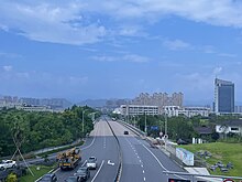 202308 Xueshi Bridge and Skyline of Dongyang.jpg