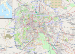 Map showing the various buildings and structures of Vatican City in purple with a red dot indicating the location of St. Peter's Basilica