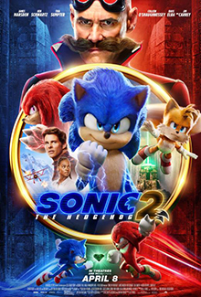 In the foreground center, Sonic, Tails, Knuckles, Tom and Maddie are within a ring with a dual background of a snowy mountain and a labyrinth with a green beam shooting from a pyramid; behind the ring is Dr. Robotnik; the background is stylistically divided into red and blue with Sonic and Knuckles in their respective colors running face to face in front of the green Master Emerald.