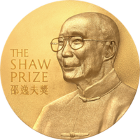 A gold circular medal with a depiction of an elderly man with glasses wearing a jacket buttoned to the neck; the English words "The Shaw Prize" and Chinese characters "邵逸夫獎" engraved on it