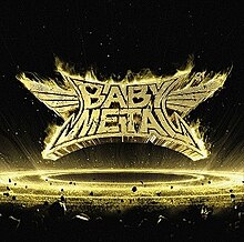 The flaming Babymetal logo, set above a ring of space debris with golden highlights and a background of outer space.