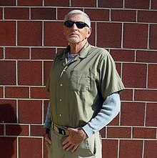 Lane posing in front of a brick wall