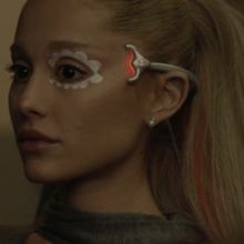 Cover art for "We Can't Be Friends (Wait for Your Love)": Ariana Grande wearing a mind-erasing device