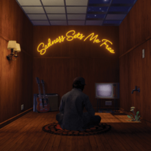 A partially animated scene of Rhys sitting in a wood-panelled room facing a TV, with the album title in yellow neon above the TV