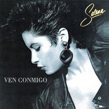 The black-and-white cover shows the singer posing with a mohawk hairdo donned in a leather jacket and a large black earpiece is visible with the singer's name and title of the album.