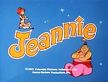 An image of a young woman sitting on a logo reading "Jeannie". A larger man is sitting in the right hand corner of the screen.