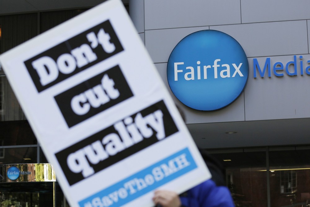 AUSTRALIA AND NEW ZEALAND OUTMandatory Credit: Photo by DAVID MOIR/EPA/REX/Shutterstock (8795969c)A Fairfax employee holds a placard outside the main offices of Fairfax Media in Sydney, Australia, 08 May 2017. Fairfax Media has received an unsolicited 2.2 billion Australian dollar (around 1.6 billion US dollar) proposal by a consortium, led by US-based private equity giant TPG Capital and Canada's Ontario Teachers' Pension Plan Board. Fairfax Media journalists are on a seven-day strike over planned mass job cuts.Fairfax Media receives proposal from consortium led by TPG, Sydney, Australia - 08 May 2017