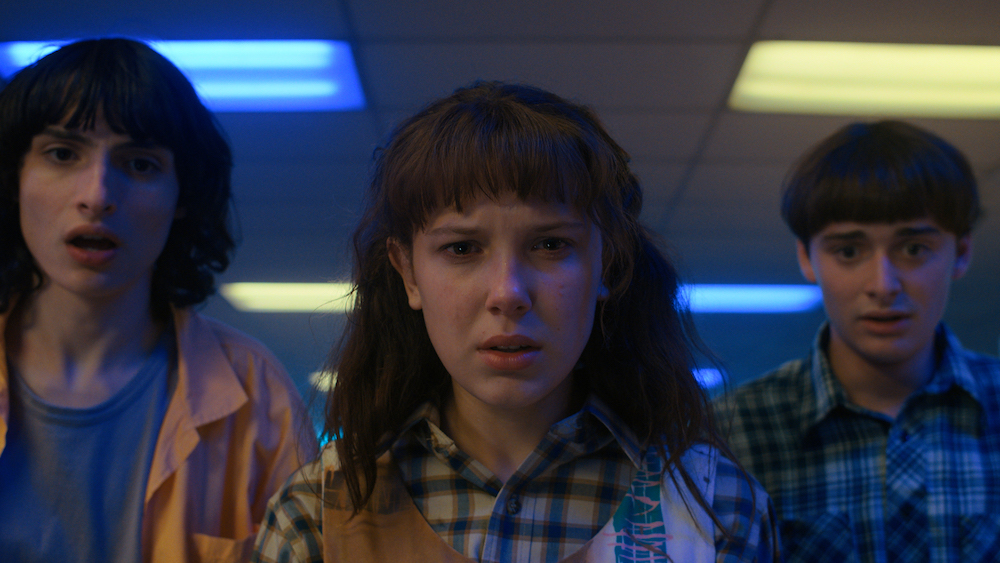 STRANGER THINGS. (L to R) Finn Wolfhard as Mike Wheeler, Millie Bobby Brown as Eleven and Noah Schnapp as Will Byers in STRANGER THINGS. Cr. Courtesy of Netflix  © 2022
