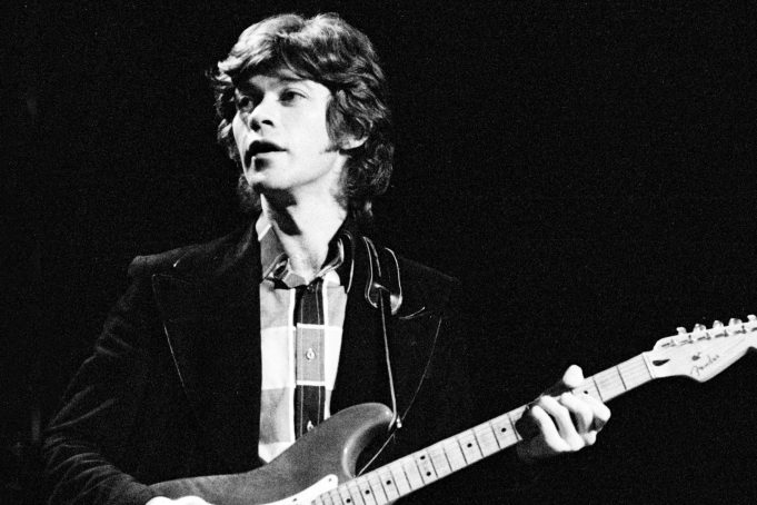 NEW YORK - JANUARY 30: Robbie Robertson of the Band performs on stage at Madison Square Garden on January 30th, 1974 in New York. He plays a Fender Stratocaster guitar. (Photo by Gijsbert Hanekroot/Redferns)