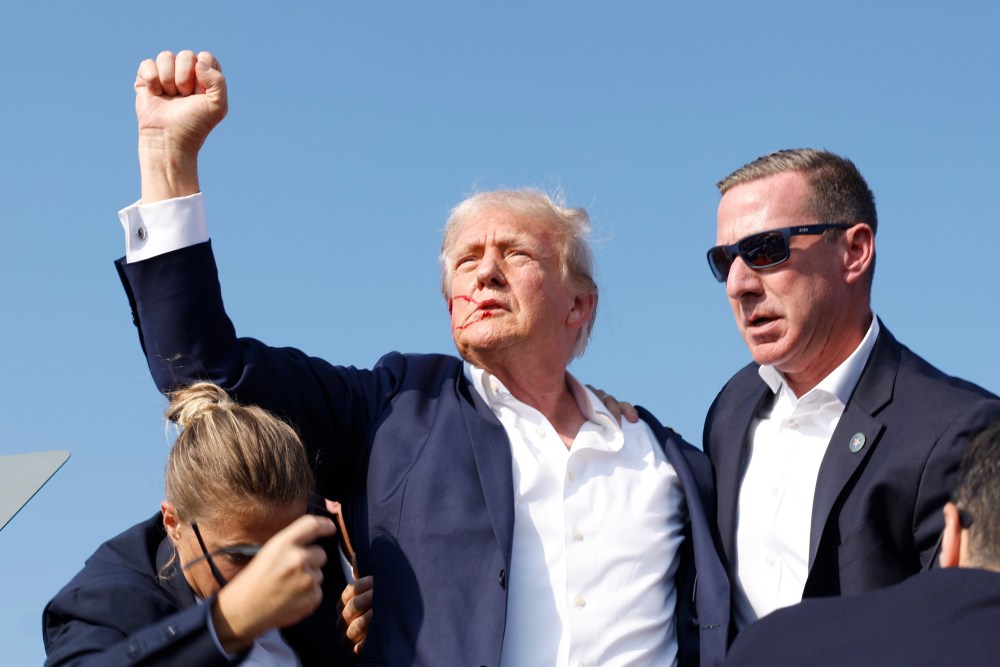 BUTLER, PENNSYLVANIA - JULY 13: Republican presidential candidate former President Donald Trump is rushed offstage during a rally on July 13, 2024 in Butler, Pennsylvania. (Photo by Anna Moneymaker/Getty Images)