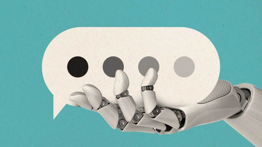 Photo illustration of a robot hand holding a speech bubble