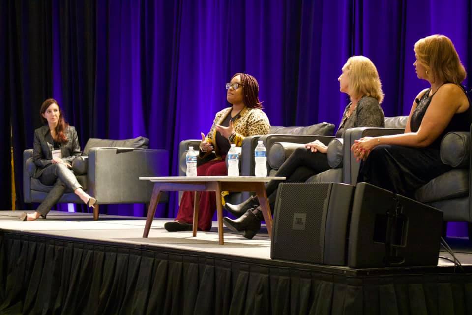 speakers participating in panel discussion